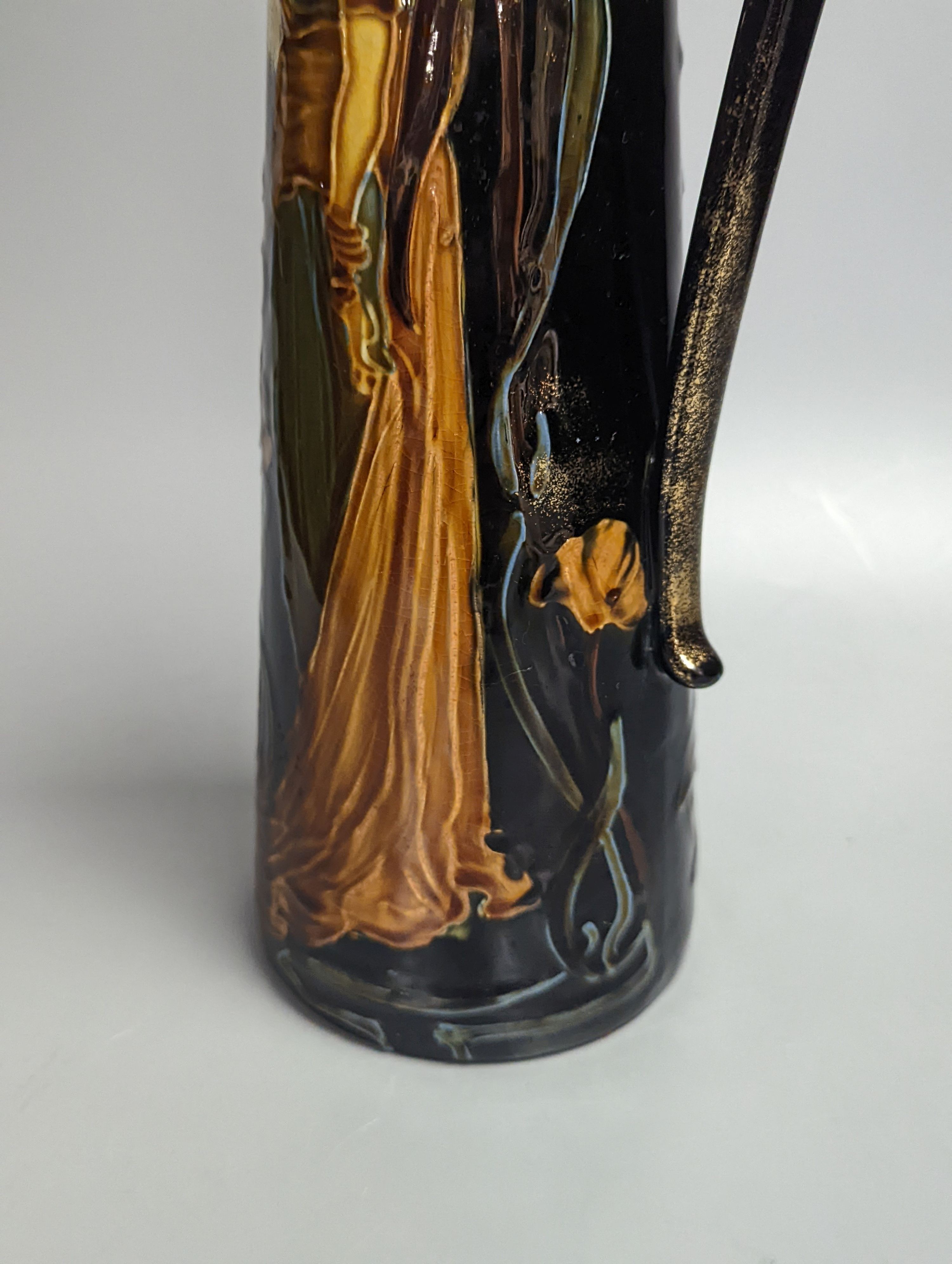 An Art Nouveau earthenware tapering jug, height 30cm